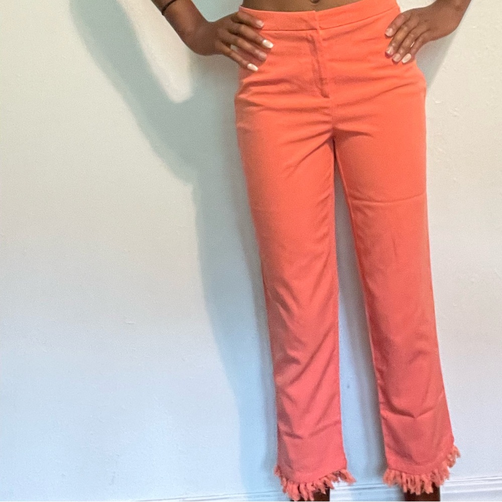 Pinkish / coral color Ankles cut pants with strings at the bottom